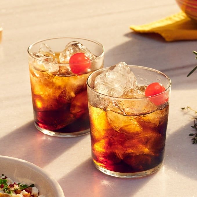 2 Black Russians with cherry garnish