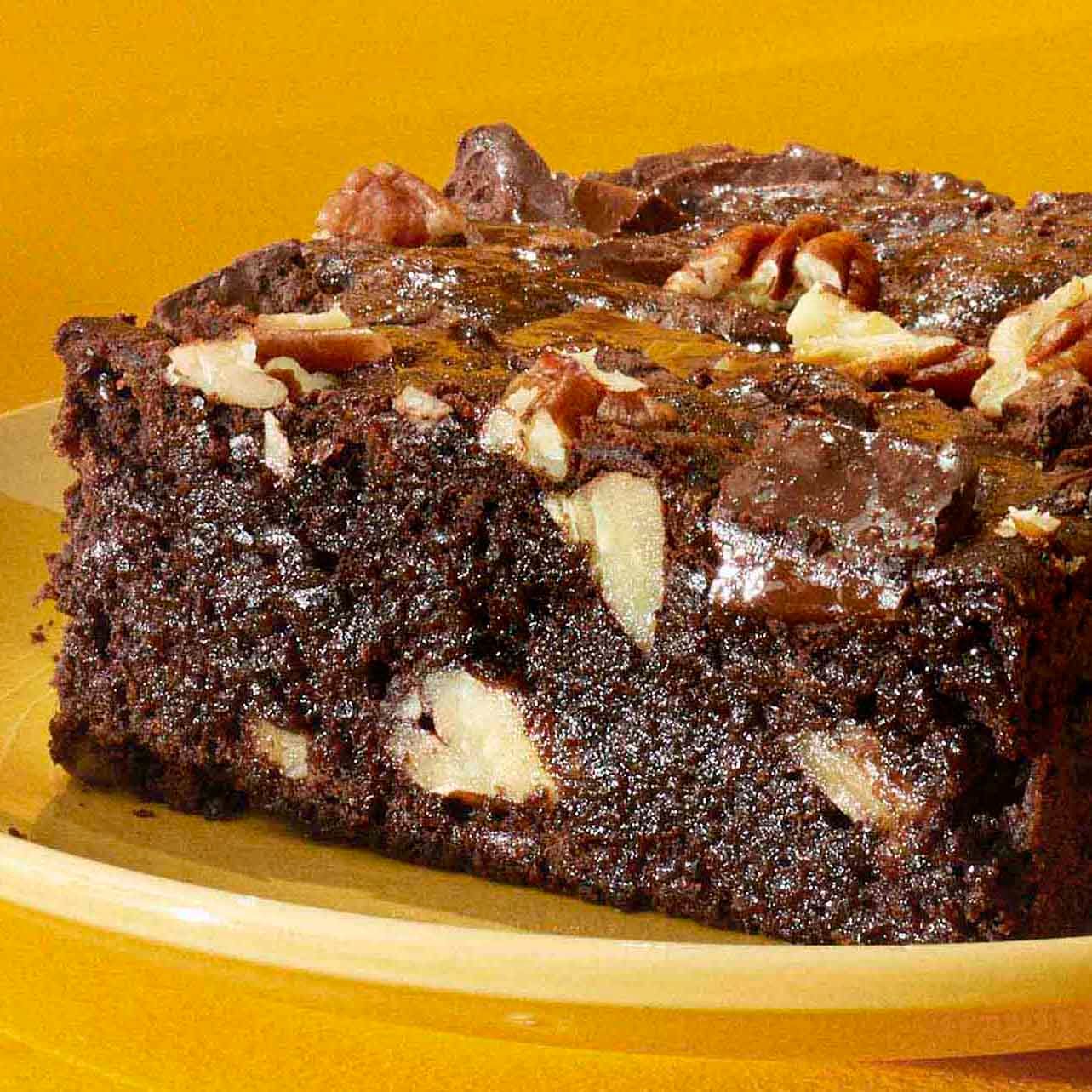 Kahlua fudge brownie dessert on a yellow plate