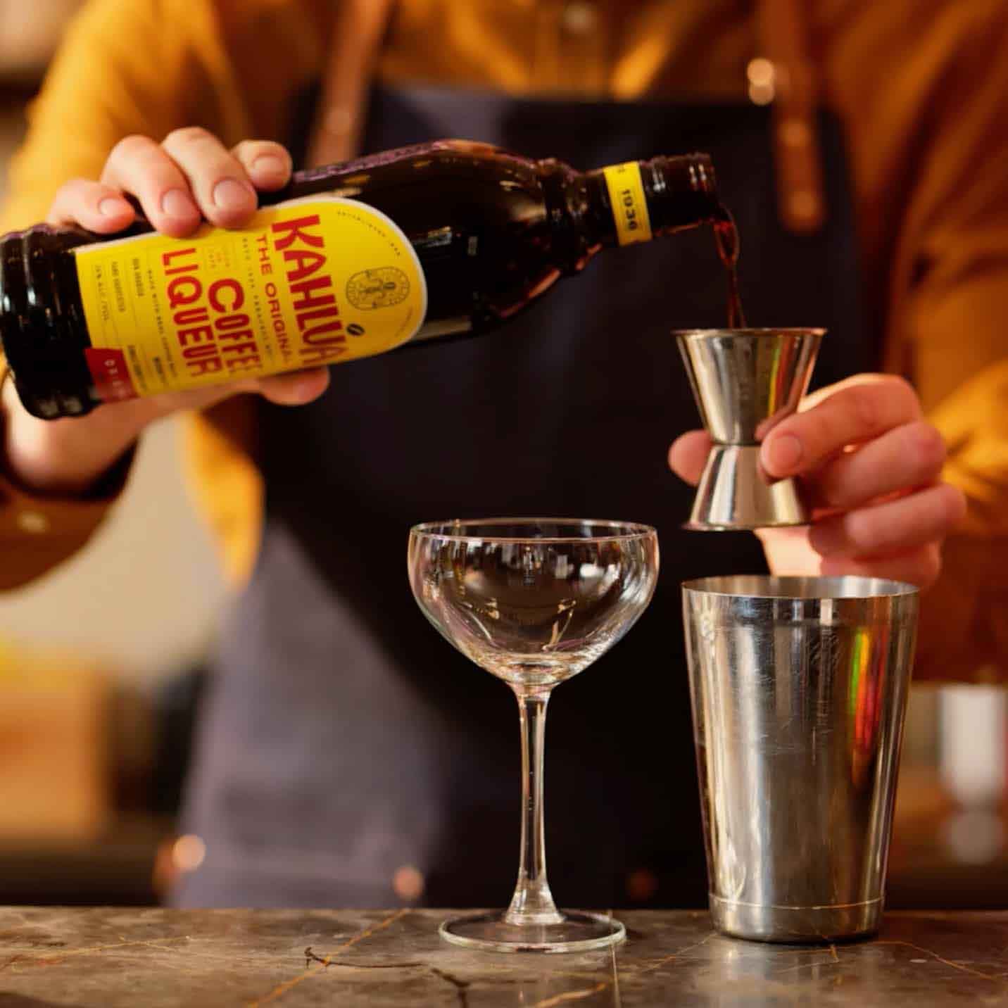 Kahlua being Poured into cocktail glass
