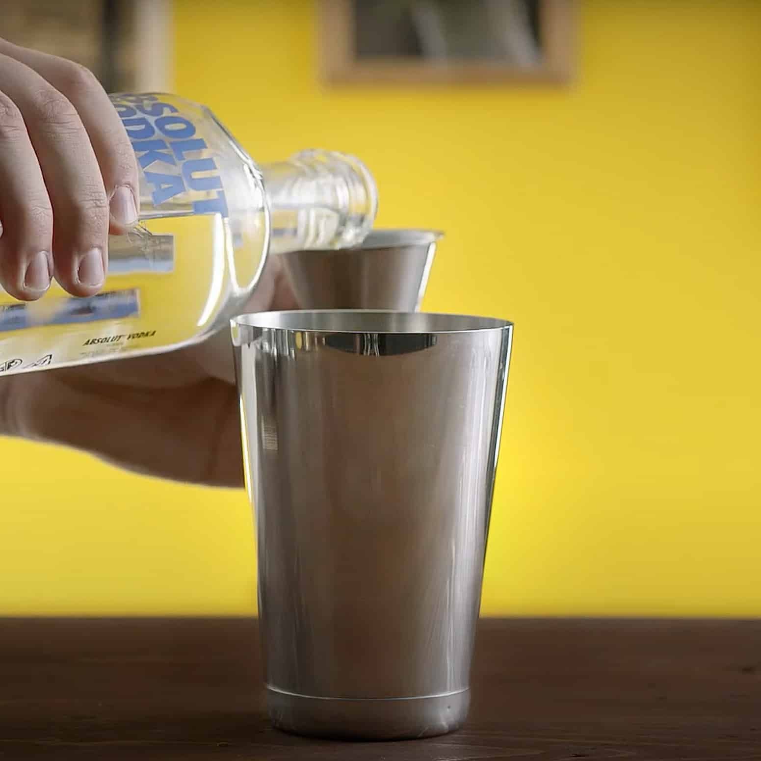 Vodka being poured into shaker