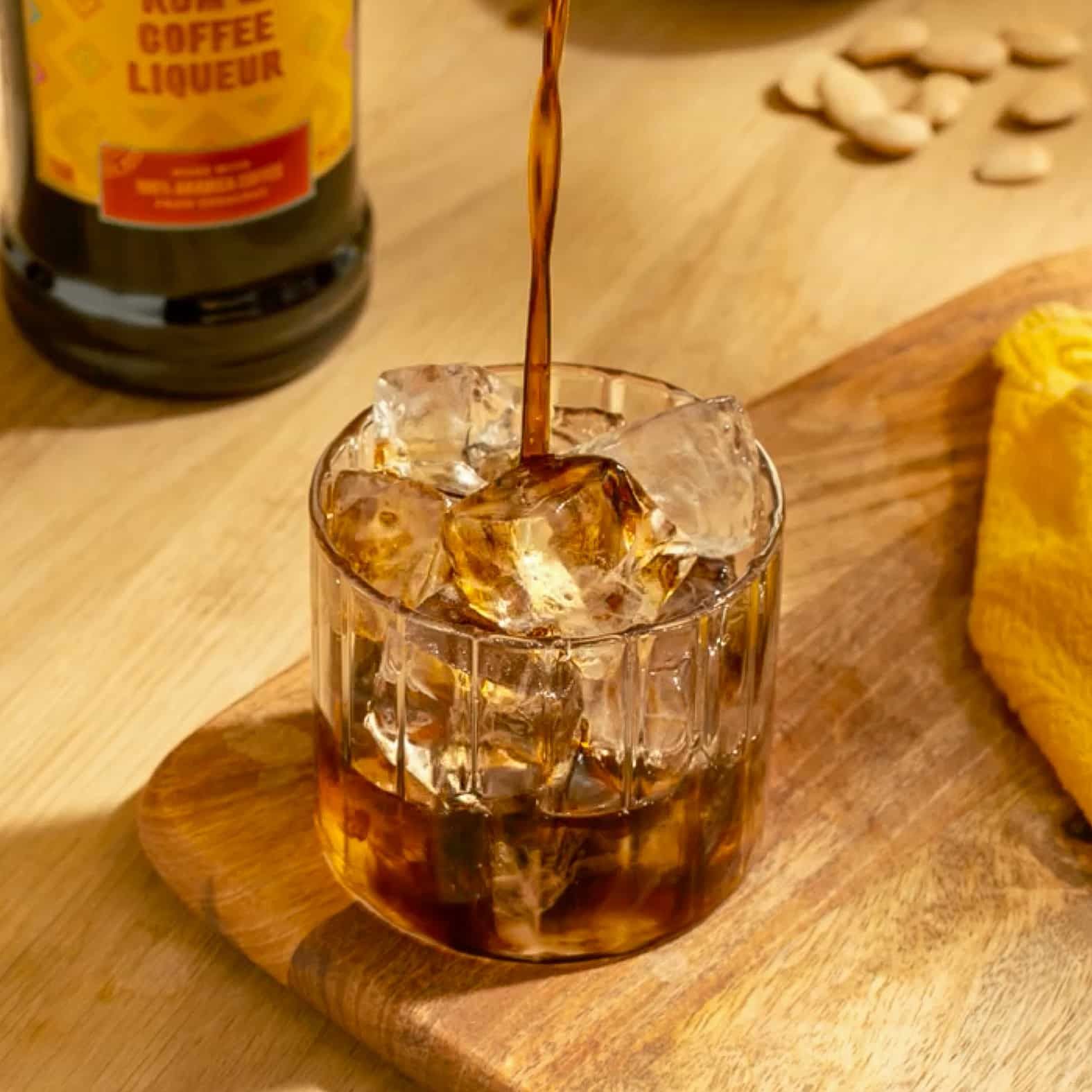 Kahlua being poured into the rocks glass
