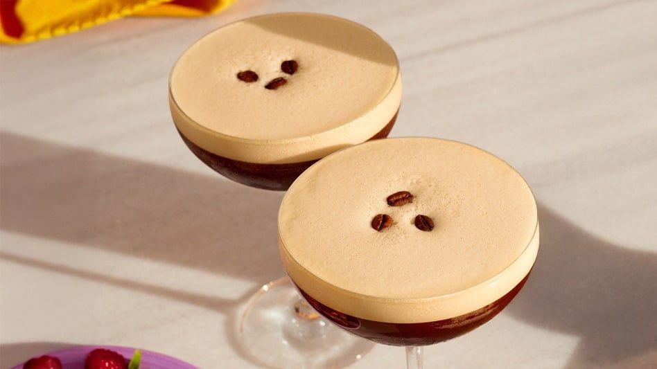 2 espresso martini's on a table