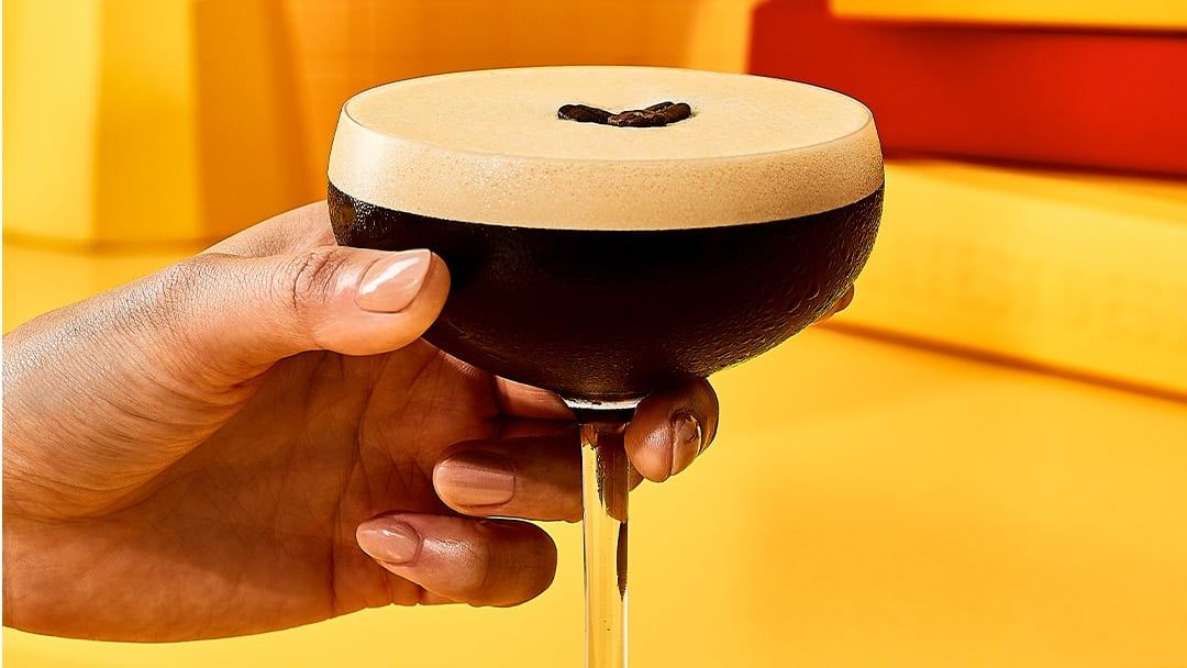 Hand holding espresso martini