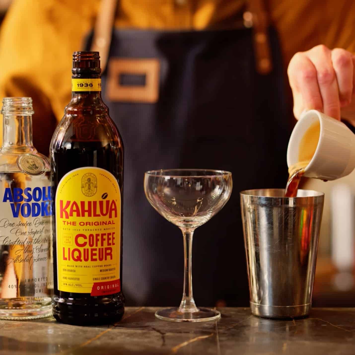 Espresso being poured in cocktail shaker