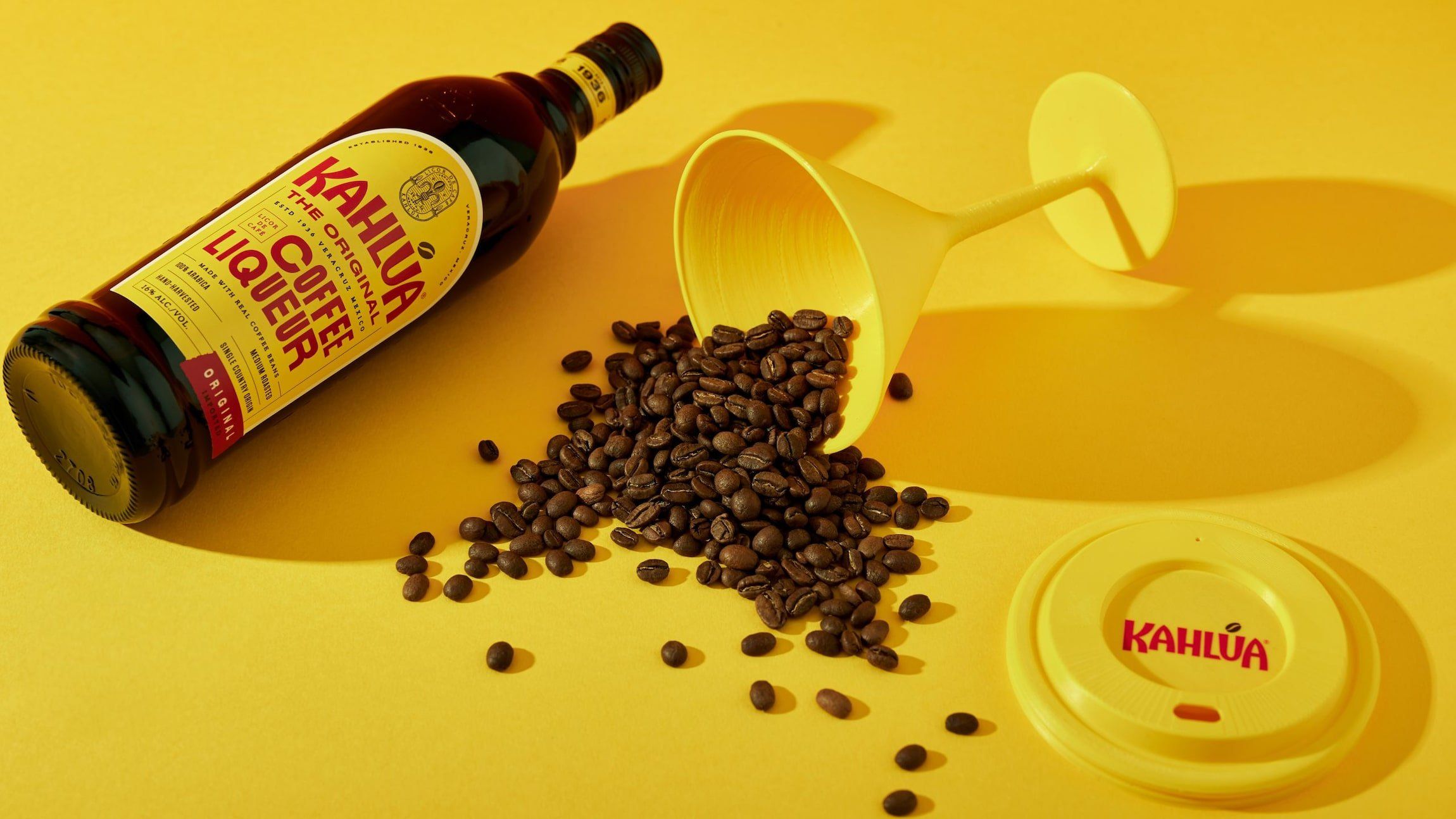 Kahlua espresso martini cocktail to go cup with a bottle of Kahlua original