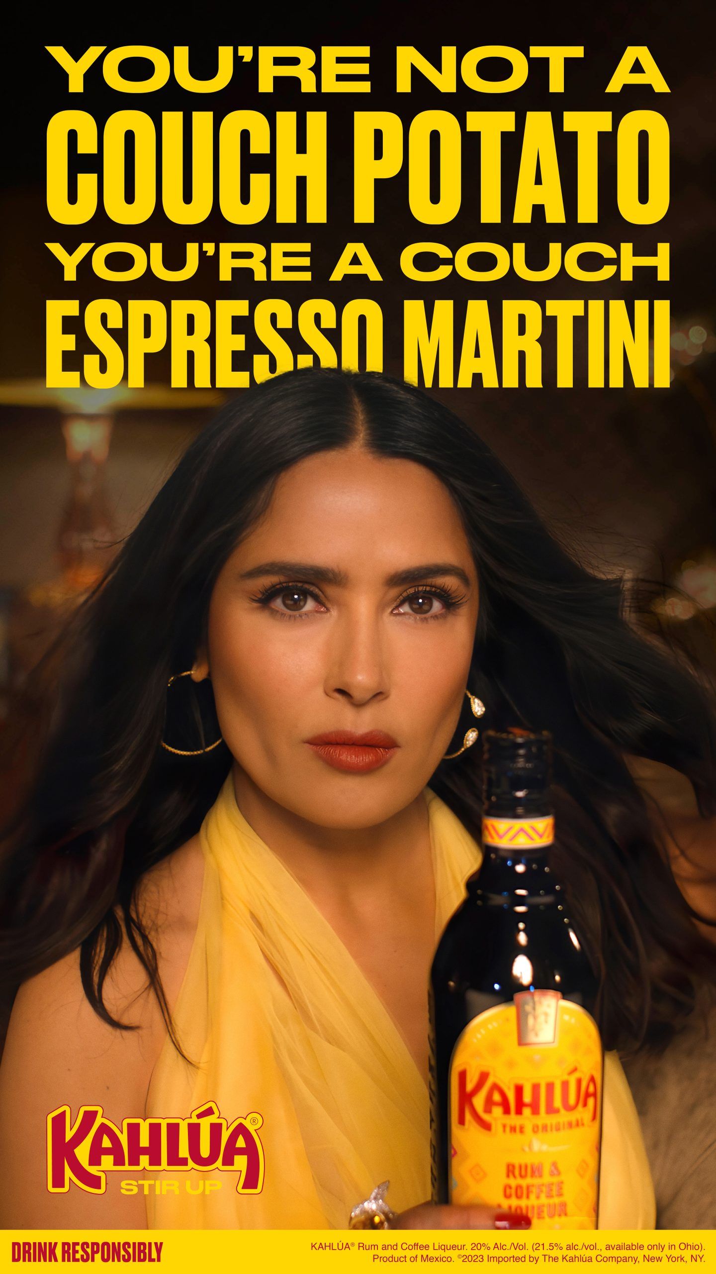 Salma Hayek holding a bottle of Kahlua