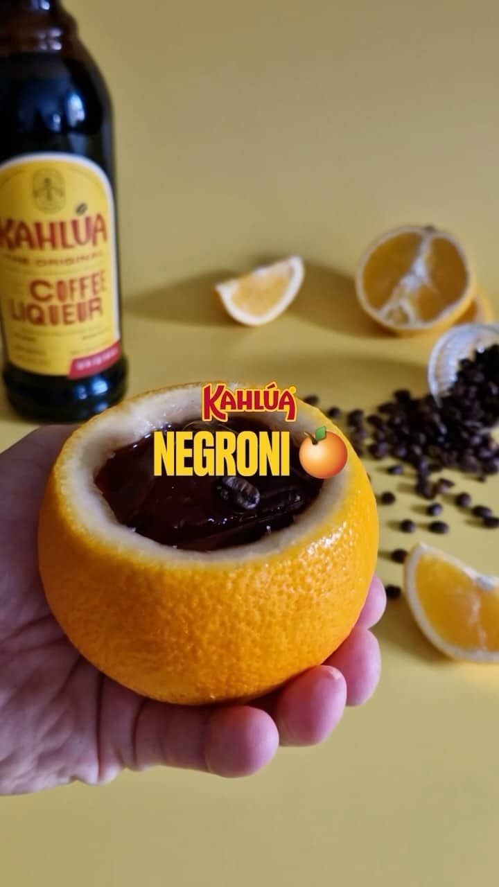 Kahlua Negroni in an orange