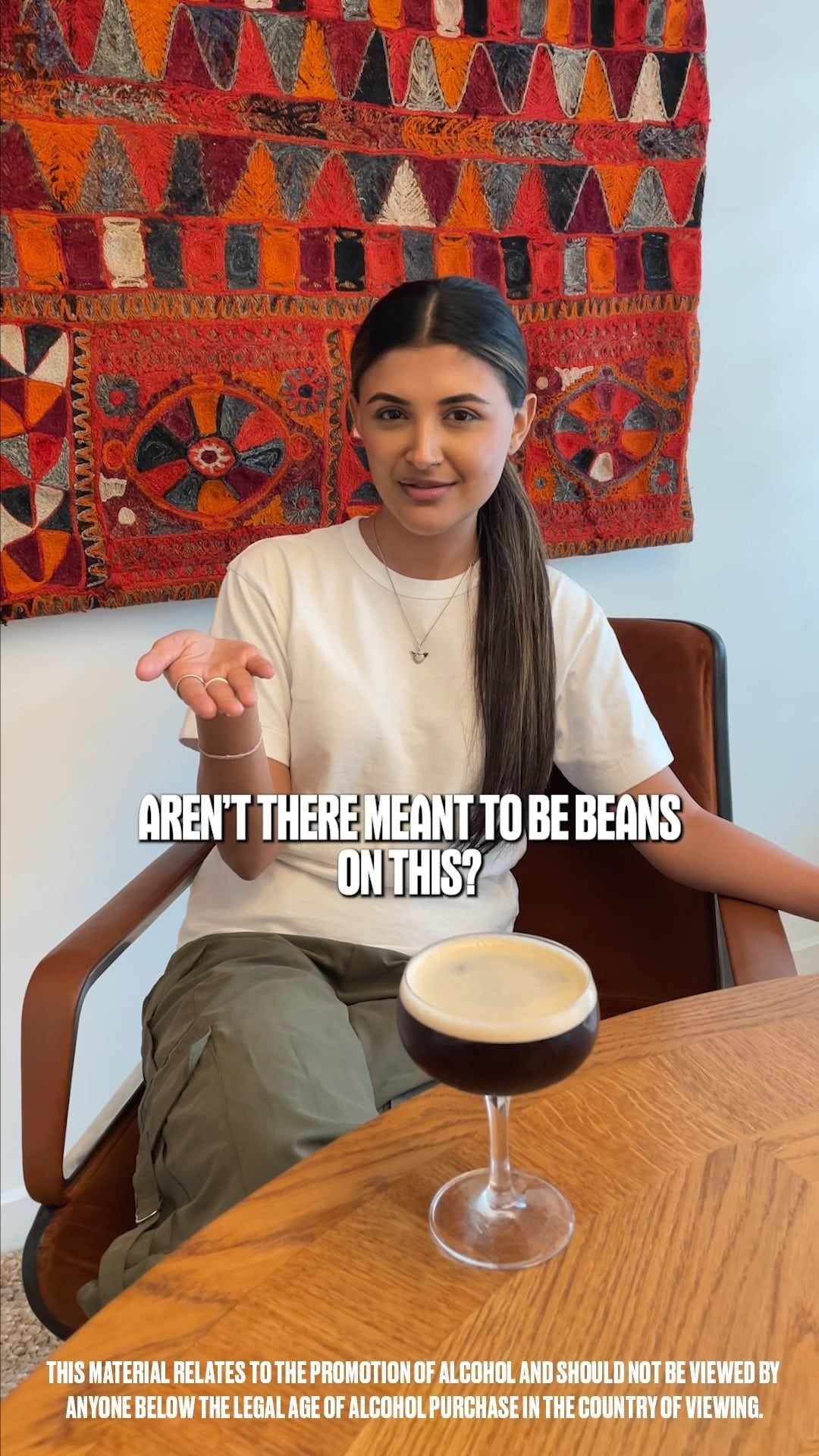 A girl asking if there aren't meant to be beans on an espresso martini cocktail