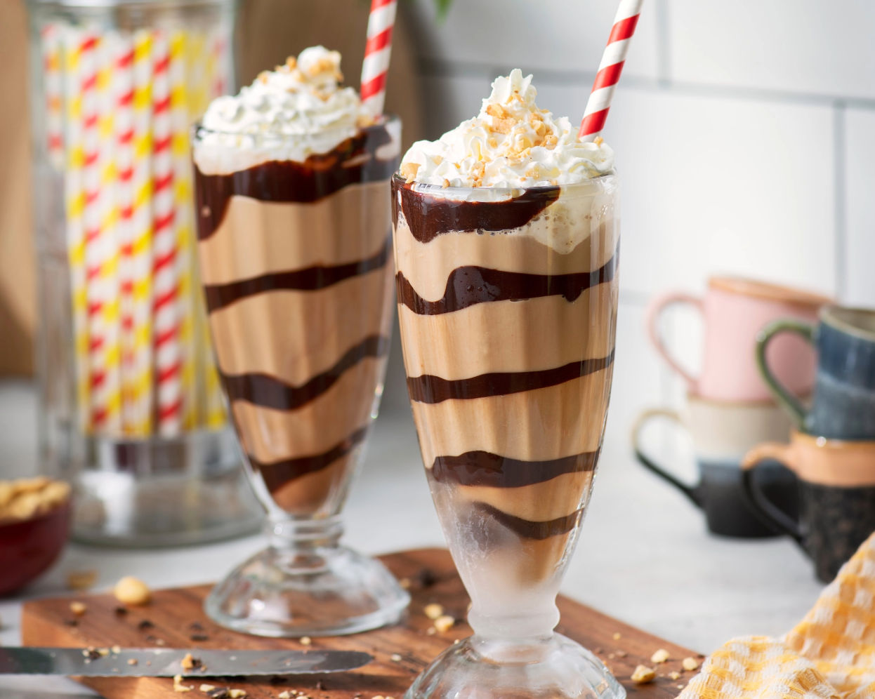 Two peanut fudge mocktails with straws