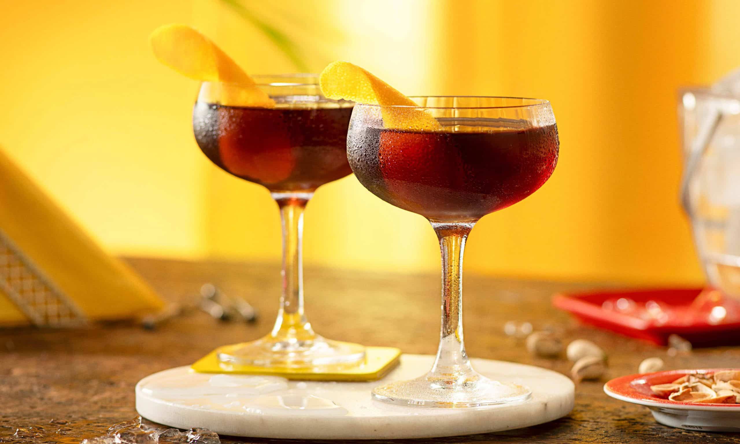 Two Revolver cocktails on a table